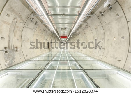 Underground walkway across road it look like Sci Fi tunnel to spaceship
