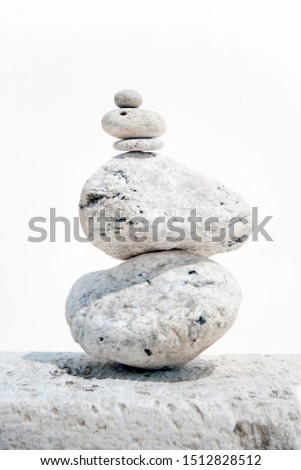 Stacked white stones in zen harmony balance.