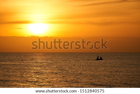 morning skyline sunrise with silhouette fisherman boat in seascape