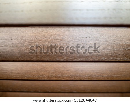Polished wooden roman blinds with wood grain