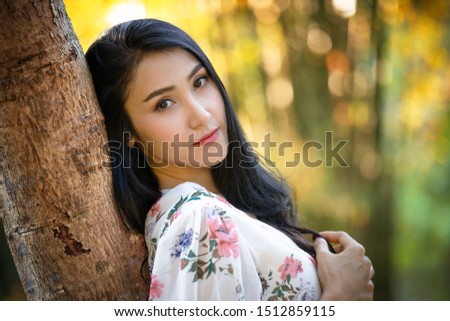 life Portrait thai model of a beautiful girl in a vintage dress in the garden and light bokeh background Retro picture. Art style