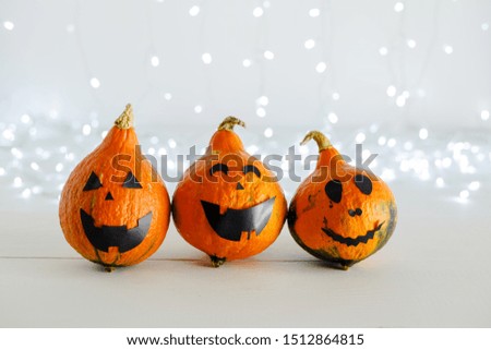 jack-o'-lantern and pumpkin on white background with lights. Happy Halloween party invitation, celebration. Halloween decorations concept. Copy space