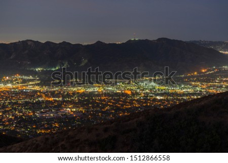 Night mountaintop view of Glendale and Griffith Park in Los Angeles, California.
