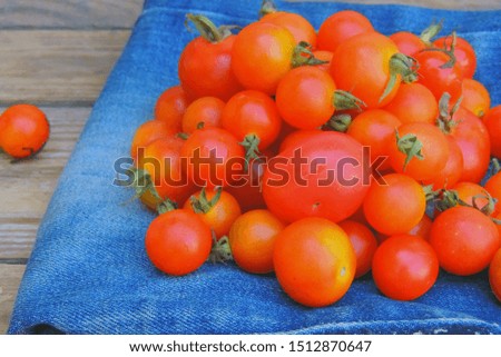 Fresh ripe cherry tomatoes scattered isolated on a white background