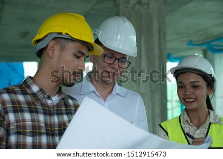 Engineers are discussing at building site