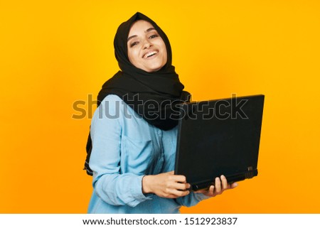 woman isolated background with laptop looking at the camera