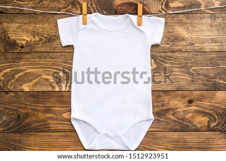 Mockup of white baby bodysuit shirt