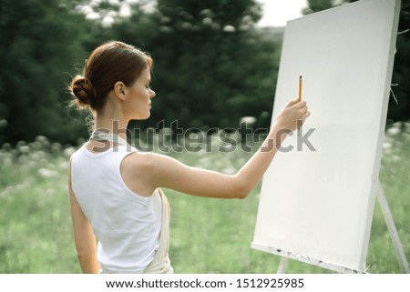 painter easel woman near canvas