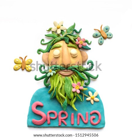 Plasticine character man with a spring beard and flowers Royalty-Free Stock Photo #1512945506