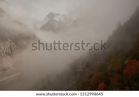 La Mer de Glace is glimpsed in the autumn fog in Chamonix-Mont-Blanc. Alps. France