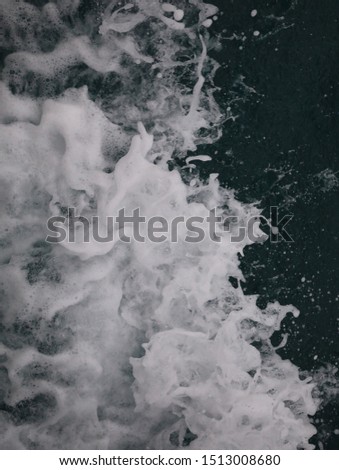 Double blurred,bokeh sponge and tsunami is blowing to the shore.High view of the flood