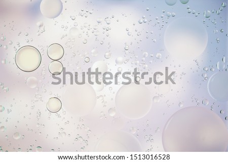 Colorful  pastel artistic image of oil drop on water for modern and creation design background.