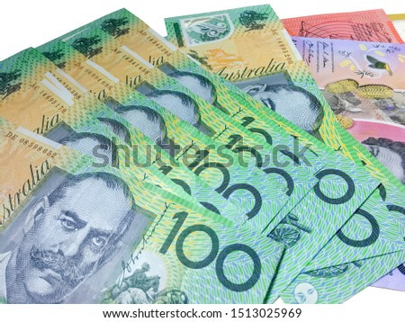 Australian 100 dollar notes closeup with white background.