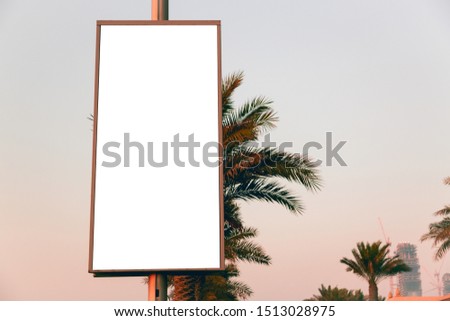 Advertisement mockup. Blank empty billboard on the city street in Dubai, UAE. Royalty-Free Stock Photo #1513028975