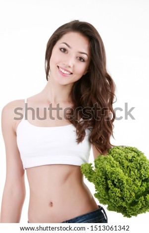 picture of healthy woman holding bunch of lettuce