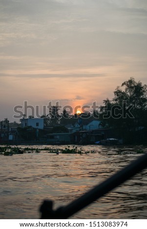 A picture of scenic sunrise in the river of Mekong delta in Vietnam