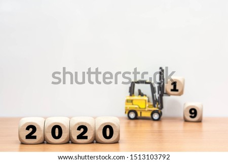 Wooden cube 2019 to 2020 service forklift on white background.
Word 2019 & 2020 wood block for copy space.