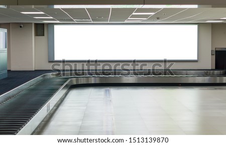 Blank billboard posters at conveyor belt luggage in the airport.
