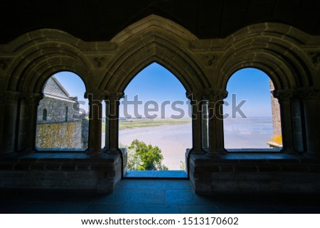 View of Mont Saint-Michel Bay from Abbey Window on a Sunny Summer Day in Normandy France Royalty-Free Stock Photo #1513170602