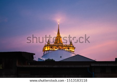 Golden Mountain temple of thailand on sunset