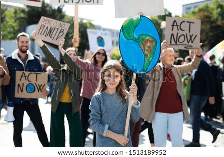 People with placards and posters on global strike for climate change. Royalty-Free Stock Photo #1513189952