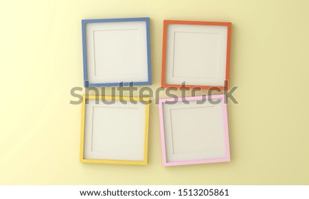 Blank yellow blue pink and orange picture frame for insert text or image inside on light yellow color wall.
