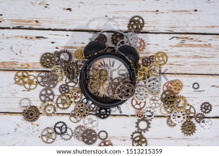 Clock gear wheels on table. Retro clock repairing abstract photo