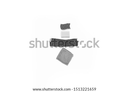 bright modern black and white flat lay top view close up minimal photo of Cleaning Equipment  sponge and colorful rags on white background whit copy space 