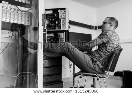 programmer in the server room at the table