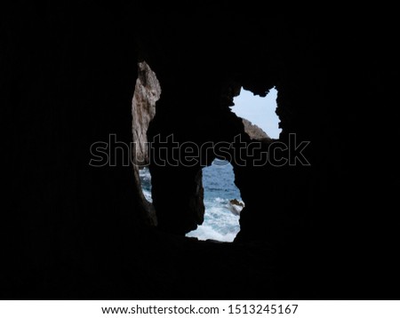 holes in the rock with the sea in the background in the cave of Minerva in the protected marine natural area of Punta Campanella. Sorrento Peninsula, Campania, Naples, Italy