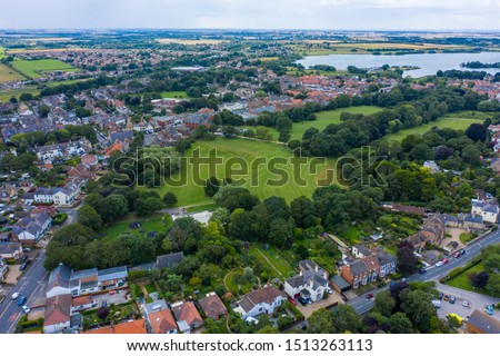 Aerial View of buildings and the mere in the seaside town of Hornsea during Summer of 2019 Royalty-Free Stock Photo #1513263113