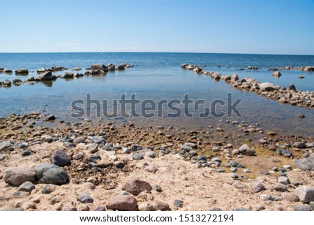 Aerial view to the Shoreline of Baltic sea beach with rocks