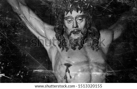 The crucifixion of Jesus Christ as a symbol of God's love. Retro styled antique statue.