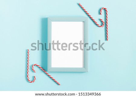 Christmas holiday composition. Xmas white and red decorations on pastel blue background. Christmas, New Year, winter concept. Flat lay, top view, copy space