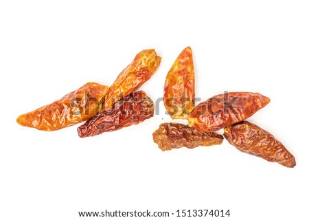 Group of seven whole dry red chili pepper peperoncino flatlay isolated on white background Royalty-Free Stock Photo #1513374014