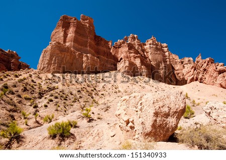 Rock formations at Charyn canyon under blue sky. State National Paleontology Park in Kazakhstan