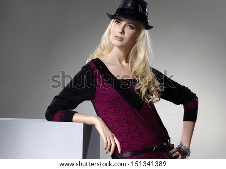 young fashion blond model posing in hat, studio shot 