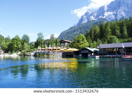 View of Lake Eibsee in Bavaria, Germany, with buildings on the bank