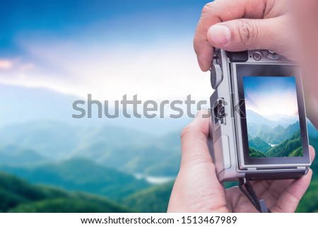 World Tourism Day concept: phone take a photo mountain view
