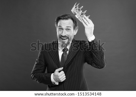 I am just superior. Become king ceremony. Award and achievement. Feeling superiority. Being superior human. Man bearded guy in suit hold golden crown symbol of monarchy. Superior and narcissistic.
