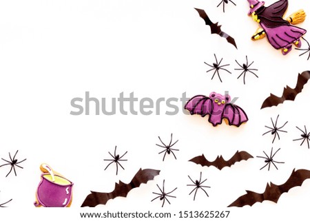 Cute Halloween decoration. Bats, spiders and special cookies on white background top view space for text