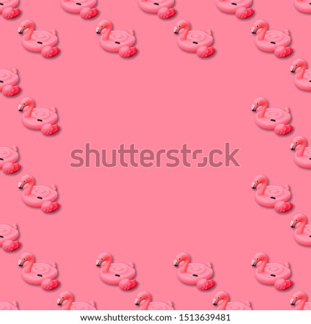 Swimming pool toy in shape of pink flamingo seamless pattern on pink background. Flamingo inflatable cut out. Top view, flat lay with copy space.