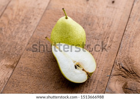 Farm Fresh Ripe Pears on  wooden background