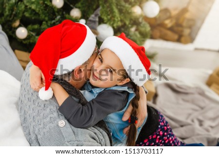 grandfather and granddaughter celebrate christmas