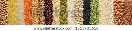 Different cereals and legumes: rice,peas, lentils, beans haricot millet buckwheat chickpea. Top view. Website header banner Royalty-Free Stock Photo #1513705616