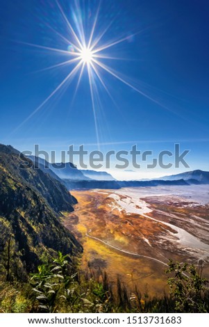 Aerial view of Sea of sand area around Mount Bromo, is an active volcano and part of the Tengger massif, in East Java, Indonesia. Famous travel destination backpacker in south east asia