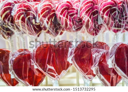 colorful lollipops in the shape of a heart, candies and sweets. Sweet background of candy for Valentine's day