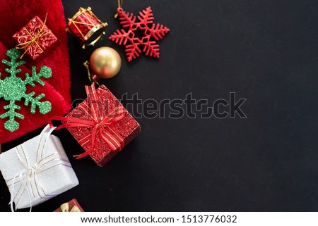 Flat lay of gift box and decoration object on wood background. Christmas and celebrations concept.
