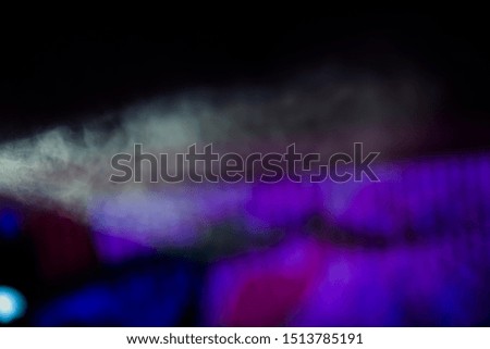 Abstract blurry concrete background with copy space,scene, stage light with colored spotlights and smoke