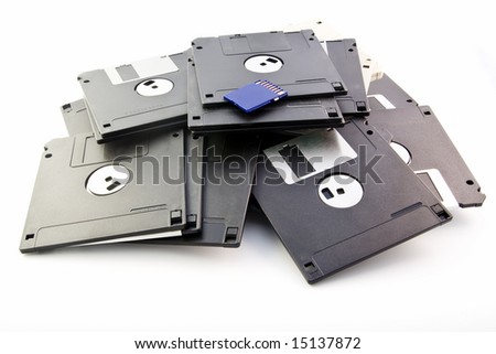 Floppy disks and flash card isolated on white background